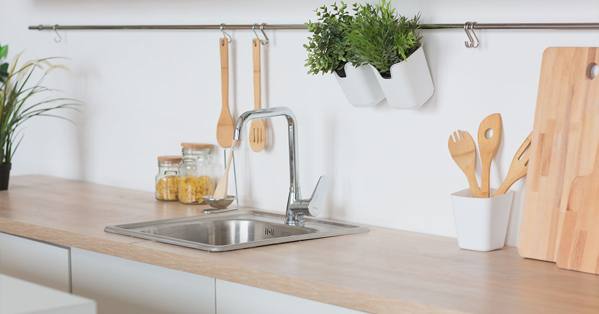 Single stainless sink on wood countertop