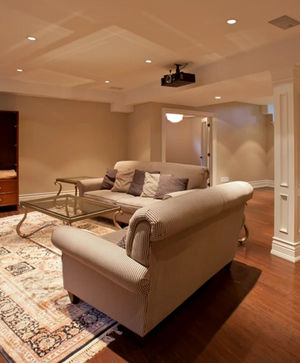 basement remodeling greenwood mo basement finishing modern basement with beige walls hardwood flooring sectional sofa and kitchenette