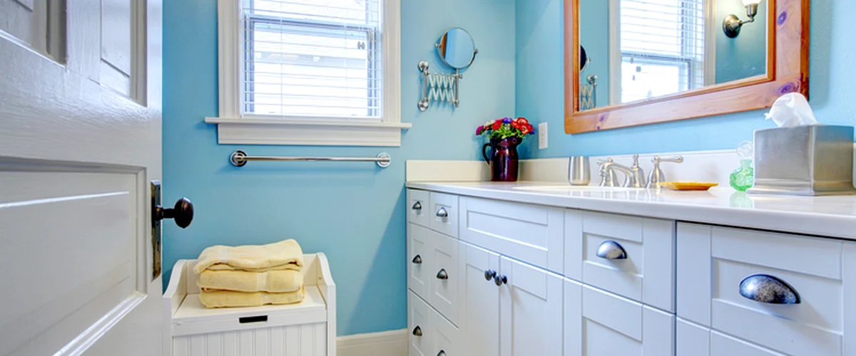 bathroom remodeling greenwood mo bright blue bathroom with white cabinetry professional lighting and modern fixtures
