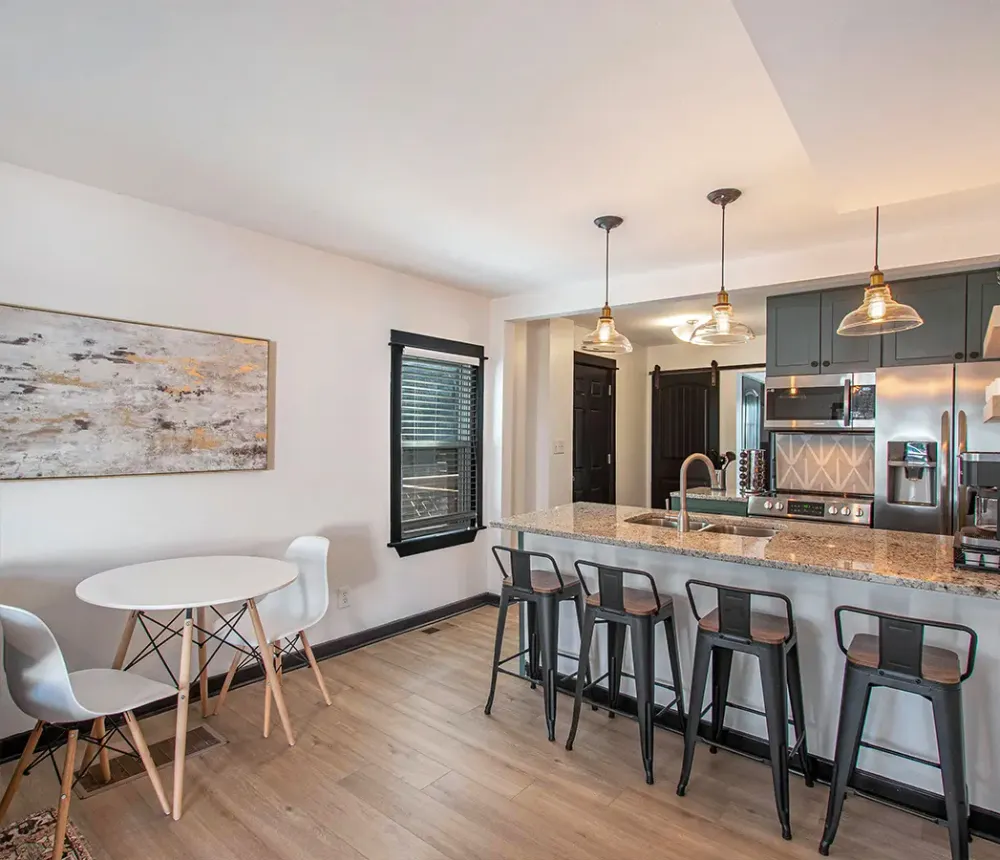 a modern kitchen and dining area with an open-concept design