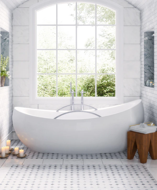 A luxury master bathroom renovation by design-build remodeling companies in Raymore, MO, featuring a modern white freestanding bathtub, marble tile flooring, and a large arched window.