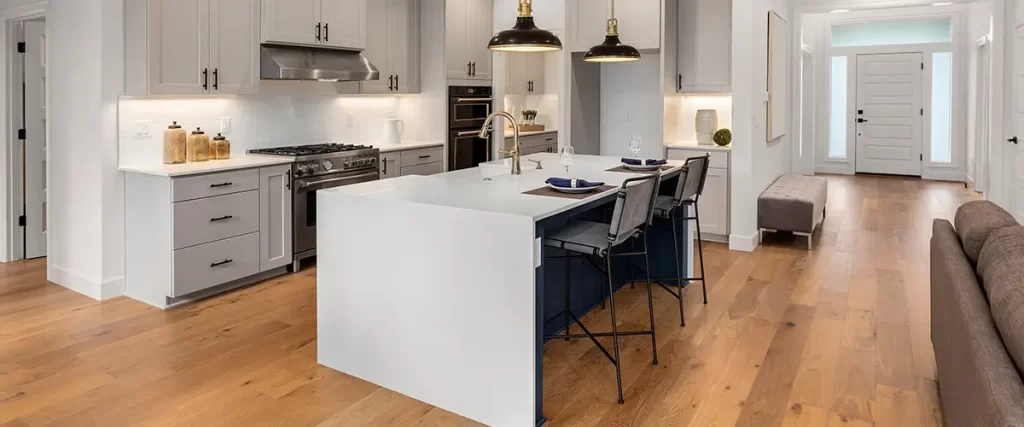 Modern kitchen remodel with quartz island, custom cabinets, and open-concept living space